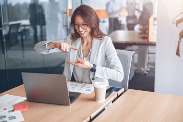 Deaf businesswoman communicating in video call at her workplace.