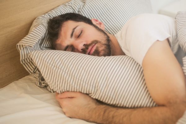Man asleep in bed