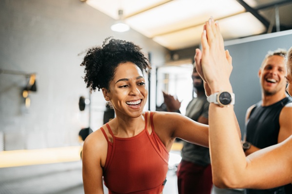 Woman celebrating accomplishment after a workout class.