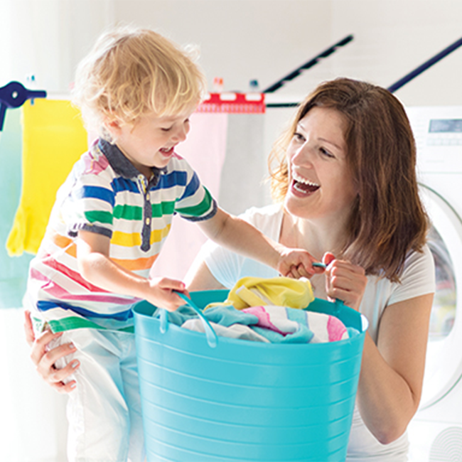 Woman and child doing laundry together