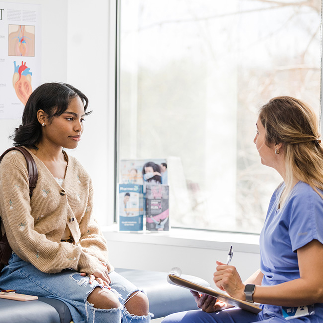 A patient sitting with a health professional